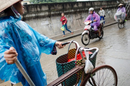 Street Vendor in Rain Coat