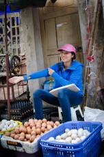 Egg Vendor with Pink Helmet